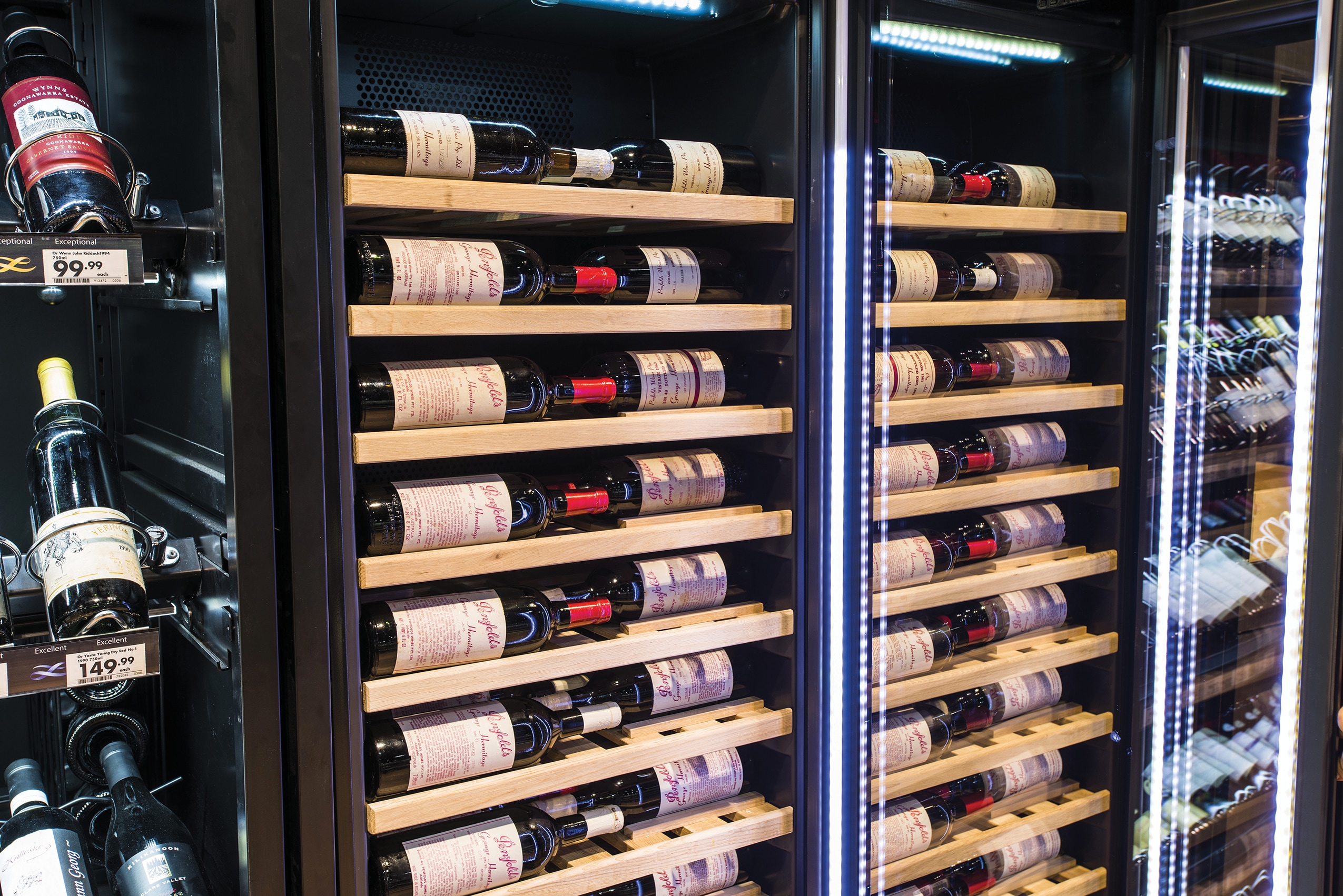 Vintec Wine Cabinets were configured with specially designed wooden shelves to lay bottles with labels facing and parallel to the glass doors to optimize visibility and accessibility.